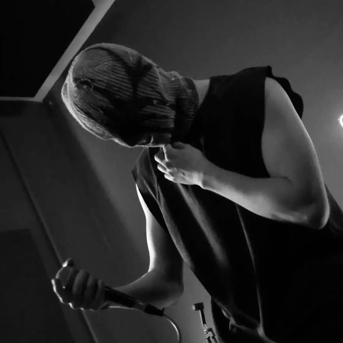 ТОЛКАЙ cover: GLAKI on stage in a balaclava, black and white
